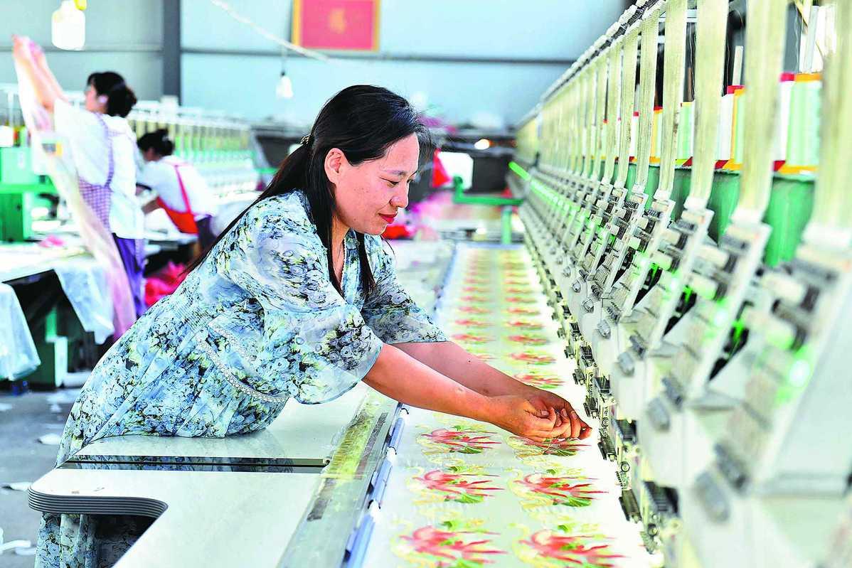 An embroidery machine is operated in Caoxian. Photo: Guo Xulei/Xinhua