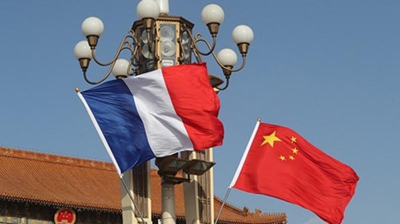 Flags of China and France. Photo: Xinhua