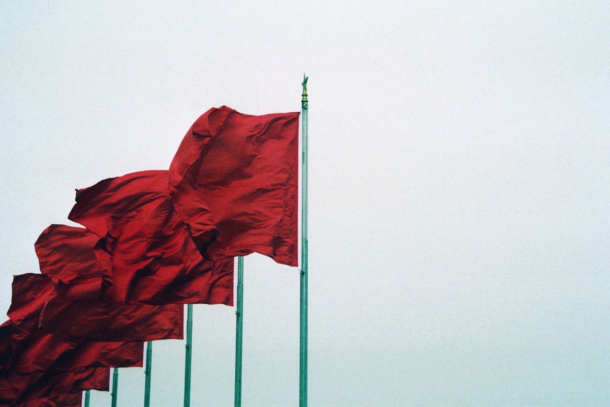 Flags gusting in the wind in Tiananmen Square. Photo by Zachary Keimig.